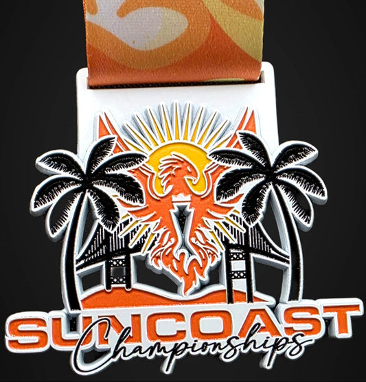 Medal with palm trees and sun design, featuring 'Suncoast Championships' text on an orange ribbon.